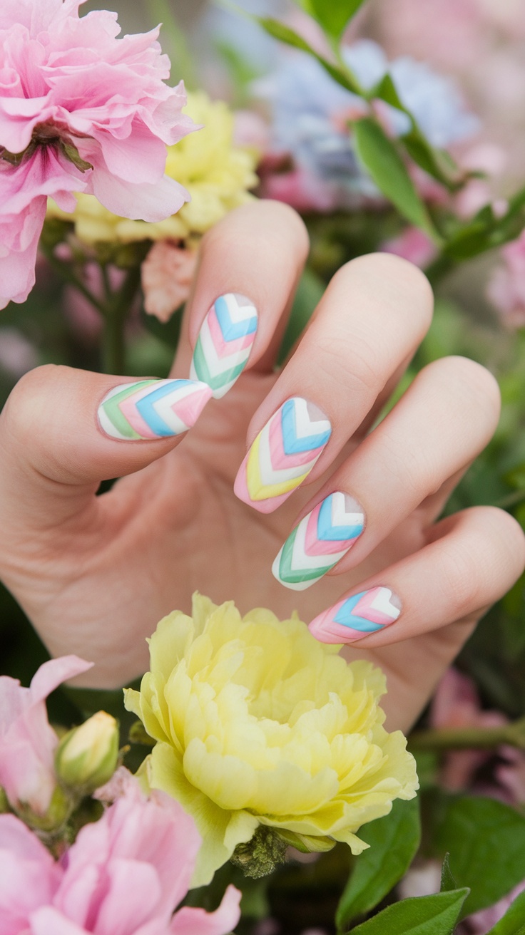 Nails featuring a vibrant chevron pattern in pastel colors with flowers in the background.