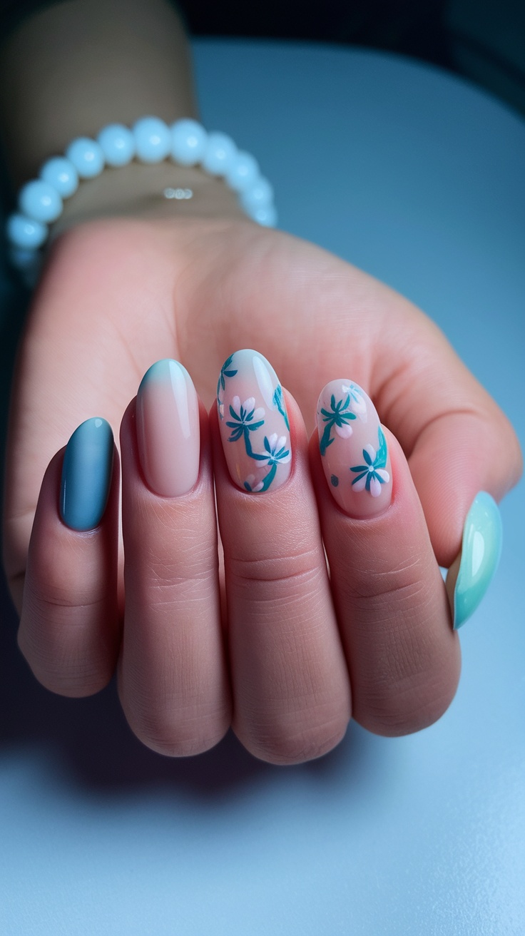 A hand showing floral accent nails with pastel colors and delicate flower designs.