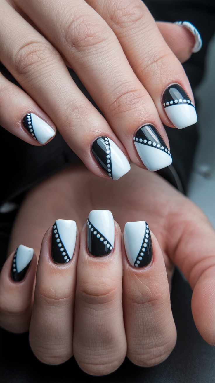 Nails designed with geometric white patterns featuring black accents and white dots